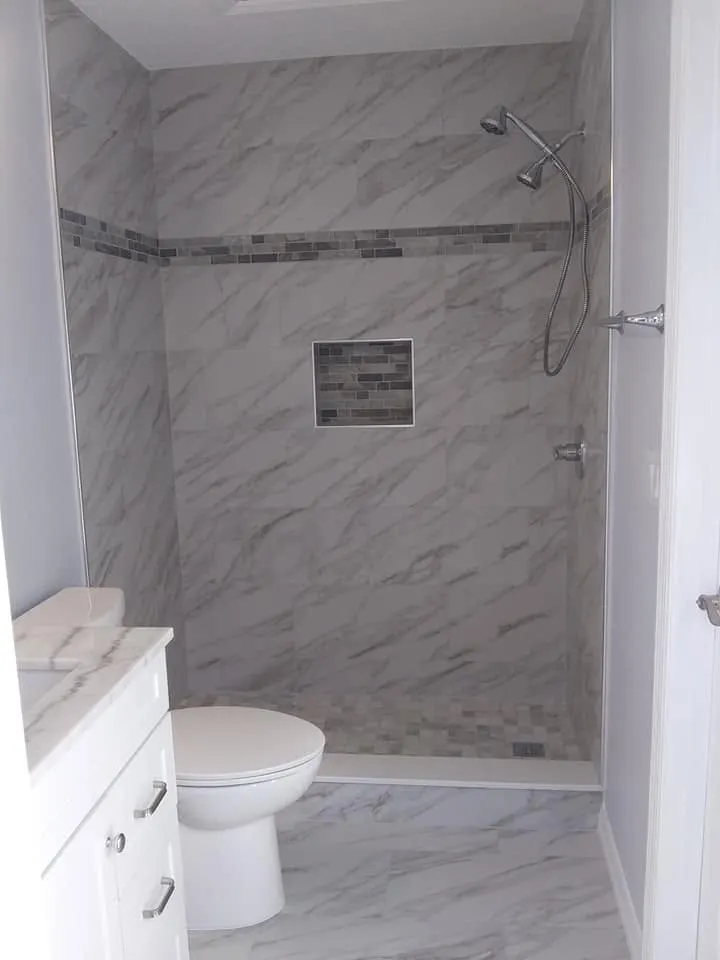 Guest bathroom remodel with shower tile and vanity area